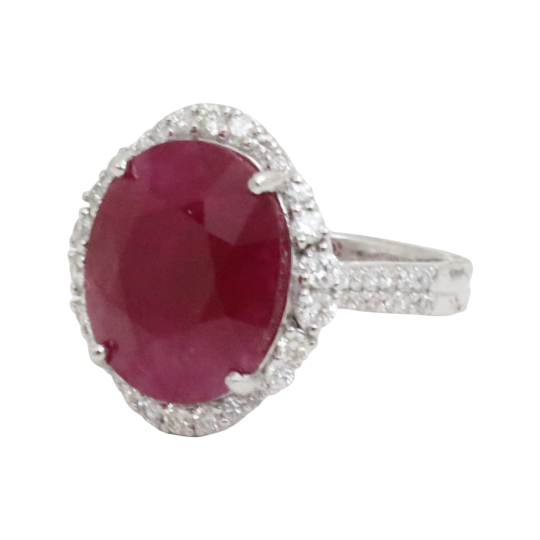 GIA BURMESE RUBY & DIAMOND RING: GIA certified 10.42ct burmese ruby and diamond ring surrounded by .71 cts of diamonds in platinum setting. gross weight 7.8grams. size 6.5. Please see all photos, appraisal, and GIA#2235859692 Note: t