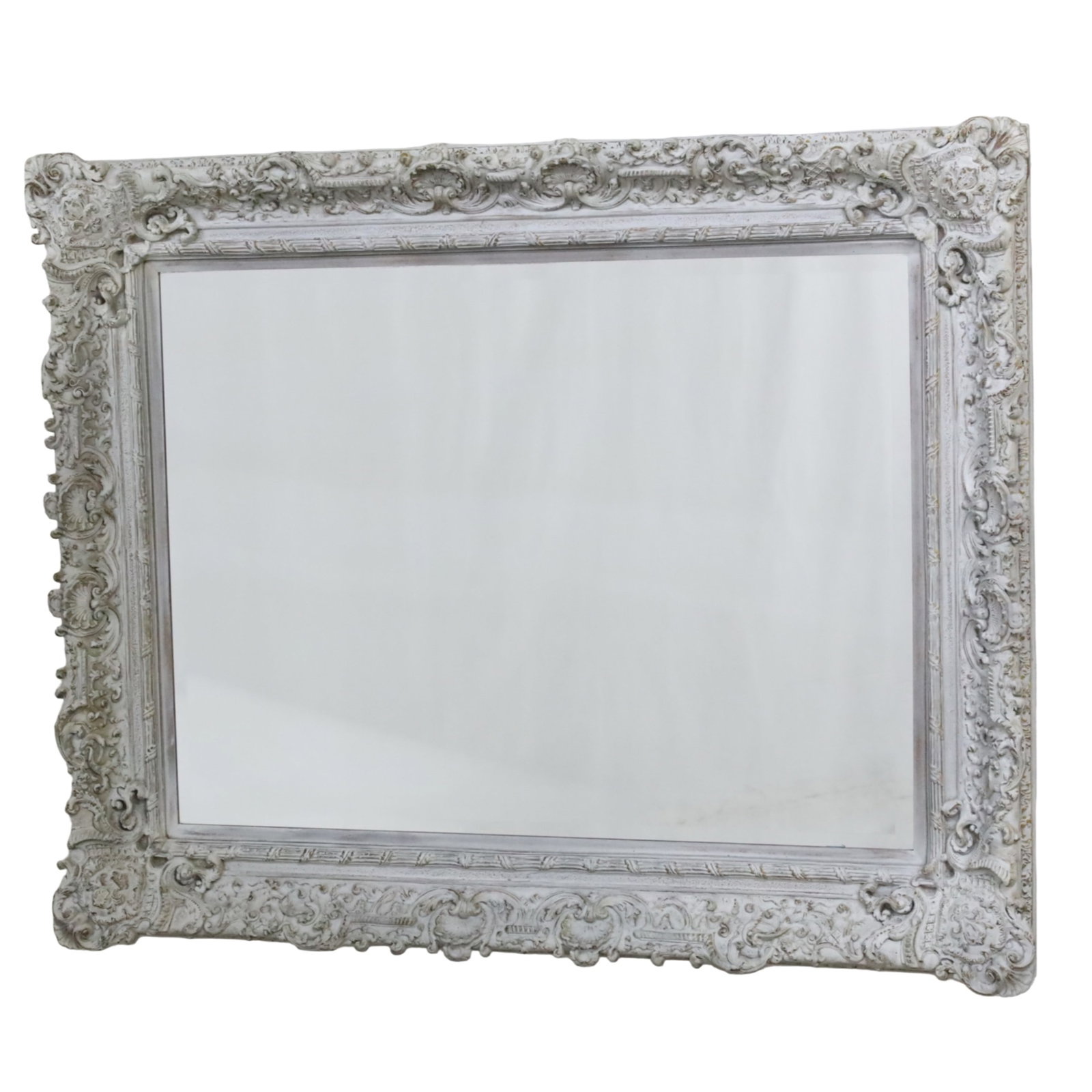 BAROQUE STYLE CARVED WOOD BEVEL GLASS MIRROR: Large Baroque style bevel glass mirror, carved wood frame with distressed white finish, 20th century; 52"H 63"W