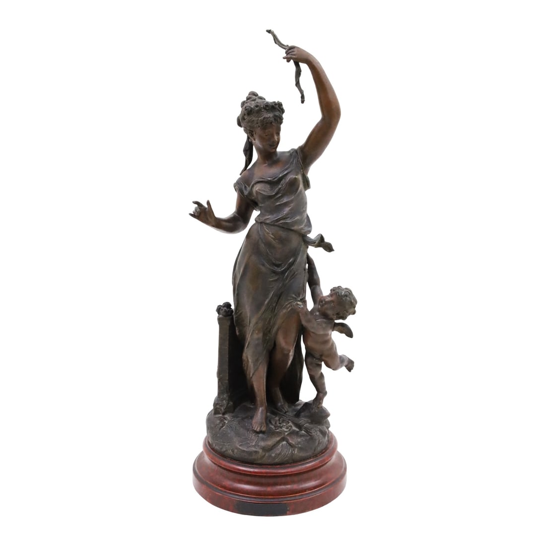 DISARMED LOVE, AFTER BRUCHON: Art Nouveau patinated metal sculpture depicting a young maiden stripping Cupid of his bow and arrow, after the work "Disarmed Love" by Emile Bruchon, resting on rouge marble plinth, early 20th