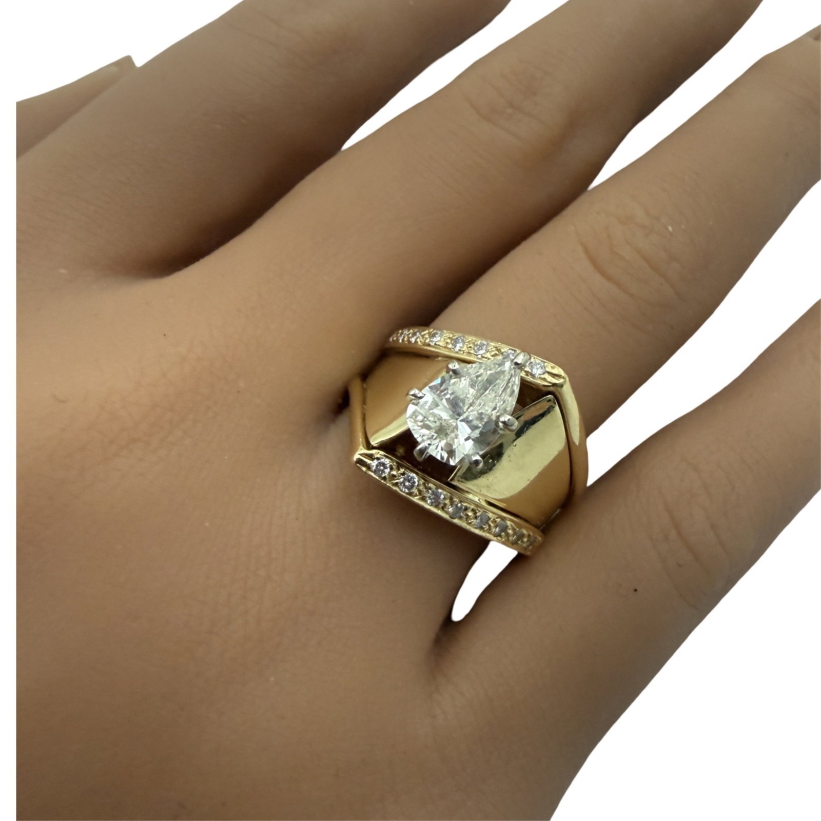 14K DIAMOND RING: 14K yellow gold and diamond ring having one pear shaped center stone weighing approximately 1.25ct. SI1clarity and L color. Note: this lot must be paid by bank wire transfer