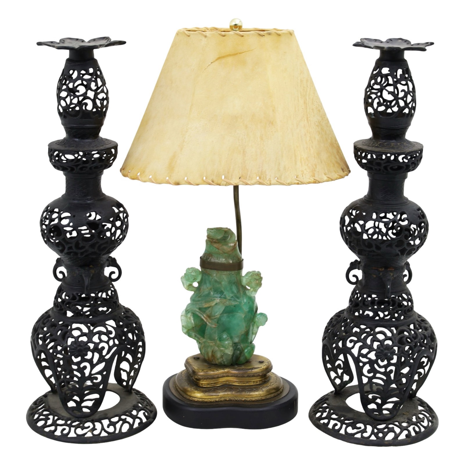 3PC LOT OF ORIENTALIA: Three piece lot of orientalia, including a Chinese green quartz capped urn, mounted base as lamp having a leather shade, along with a pair of metal scrollwork pricket style candlesticks, 20th century;