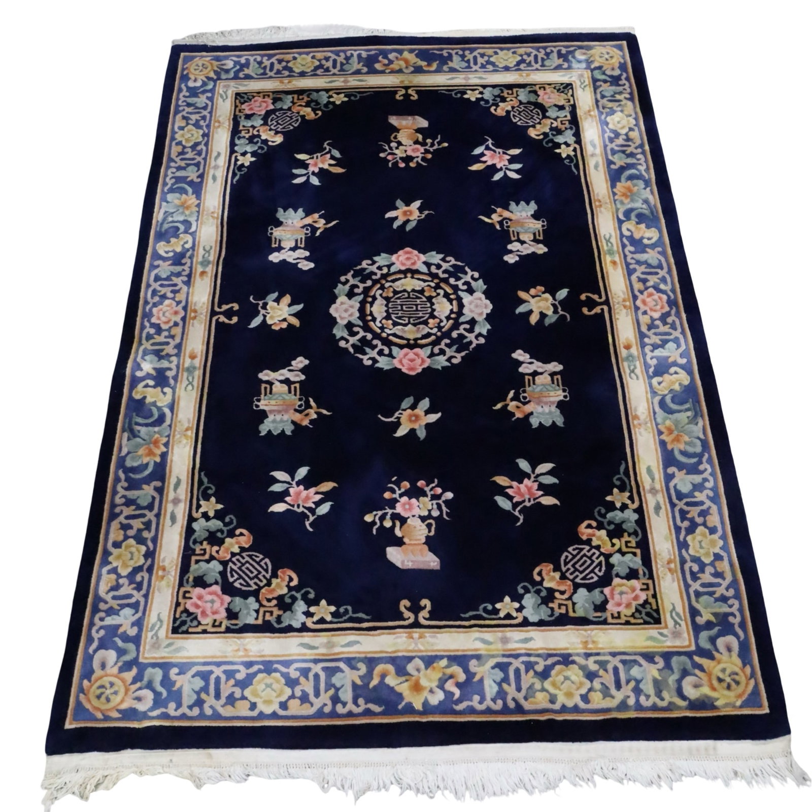 CHINESE PEKING RUG 9'5 X 6'1: Chinese Peking oriental rug with a navy blue field decorated with happiness and propserity elements, elaborate floral border, mid 20th century; 9'5 X 6'1