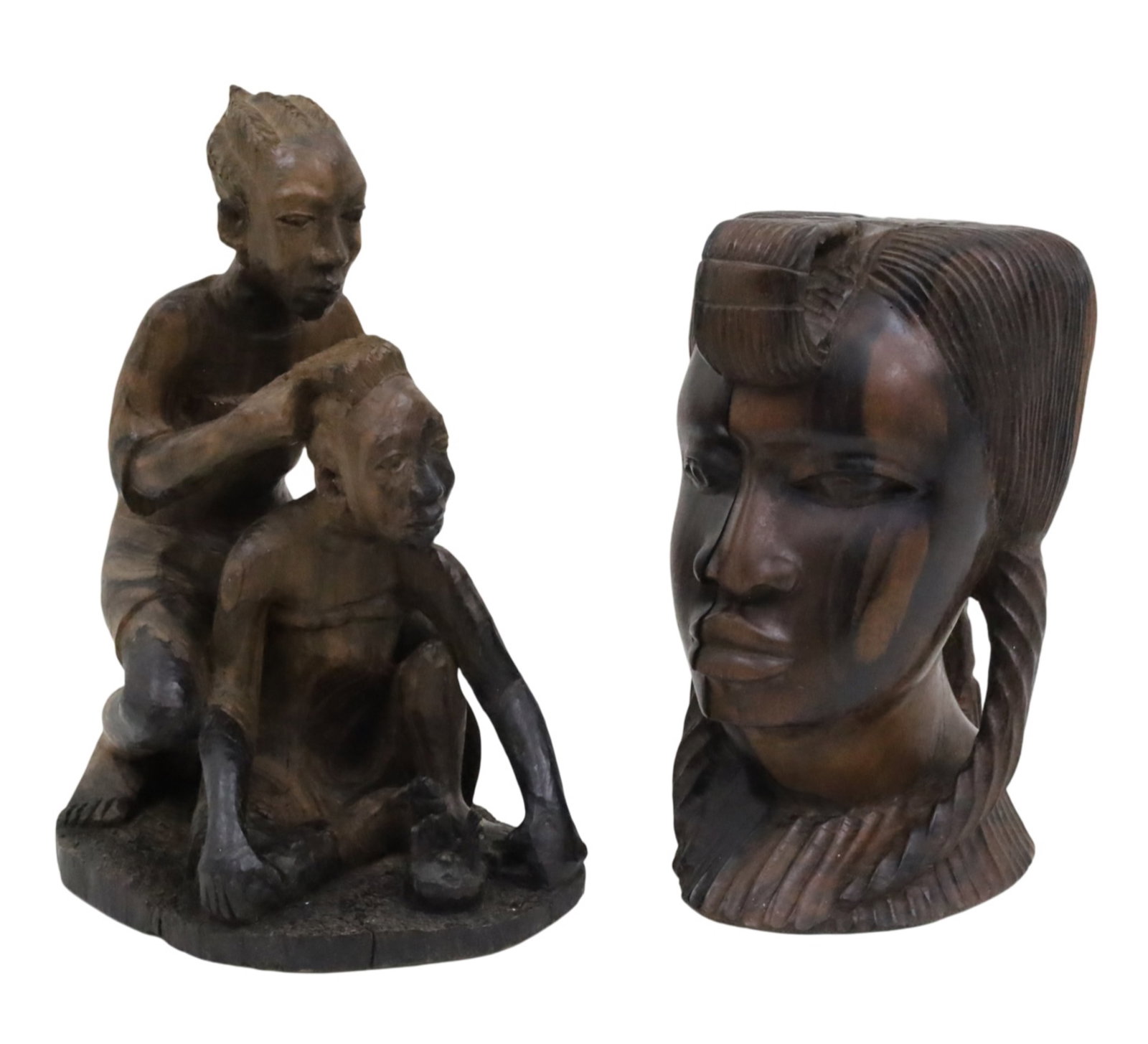 TWO WEST AFRICAN ROSEWOOD CARVINGS: Two West African rosewood carvings, one of a mother braiding another figure's hair, signed "Made by S.M. Ariyo" to underside, the other carving a female bust, 20th century; 13.5"H and 11"H; Provenance