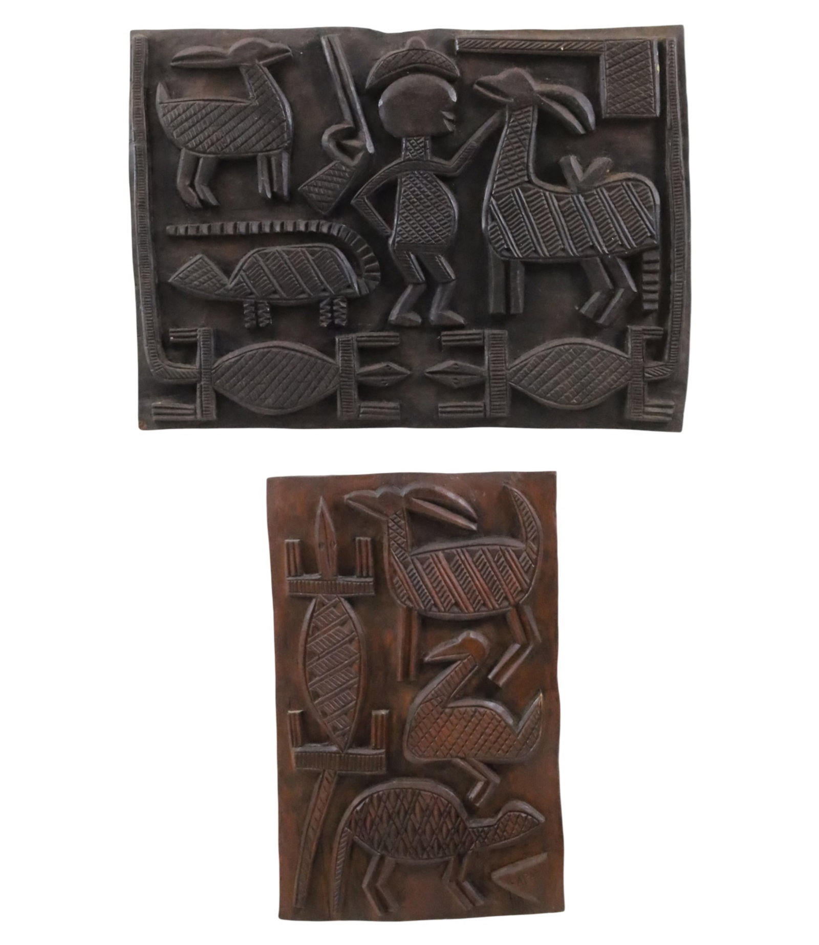 TWO AFRICAN NUPE CARVED WOOD PANELS: Two African carved wood panels, Nupe people, both featuring stylized animals and figures, one inscribed "Lapai" to lower right corner. Lapai, Nigeria, mid-20th century; 18.5"H 25.5"W and 21"H 13.5"W; 