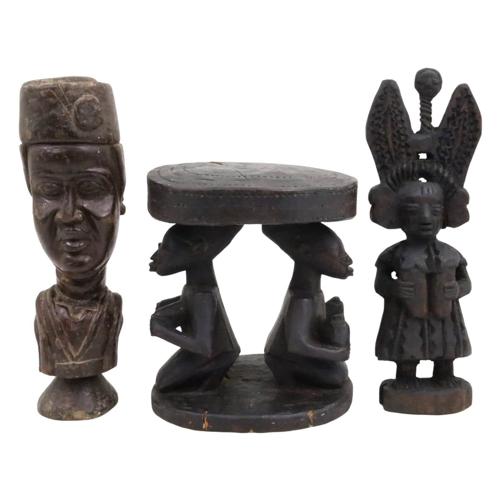 THREE AFRICAN YORUBA FIGURAL CARVINGS: Group of three African figural carvings, Yoruba people, Nigeria, including a bust of man in a kufi hat and stylized upper torso, along with an ebony stool with oval top supported by two kneeling femal