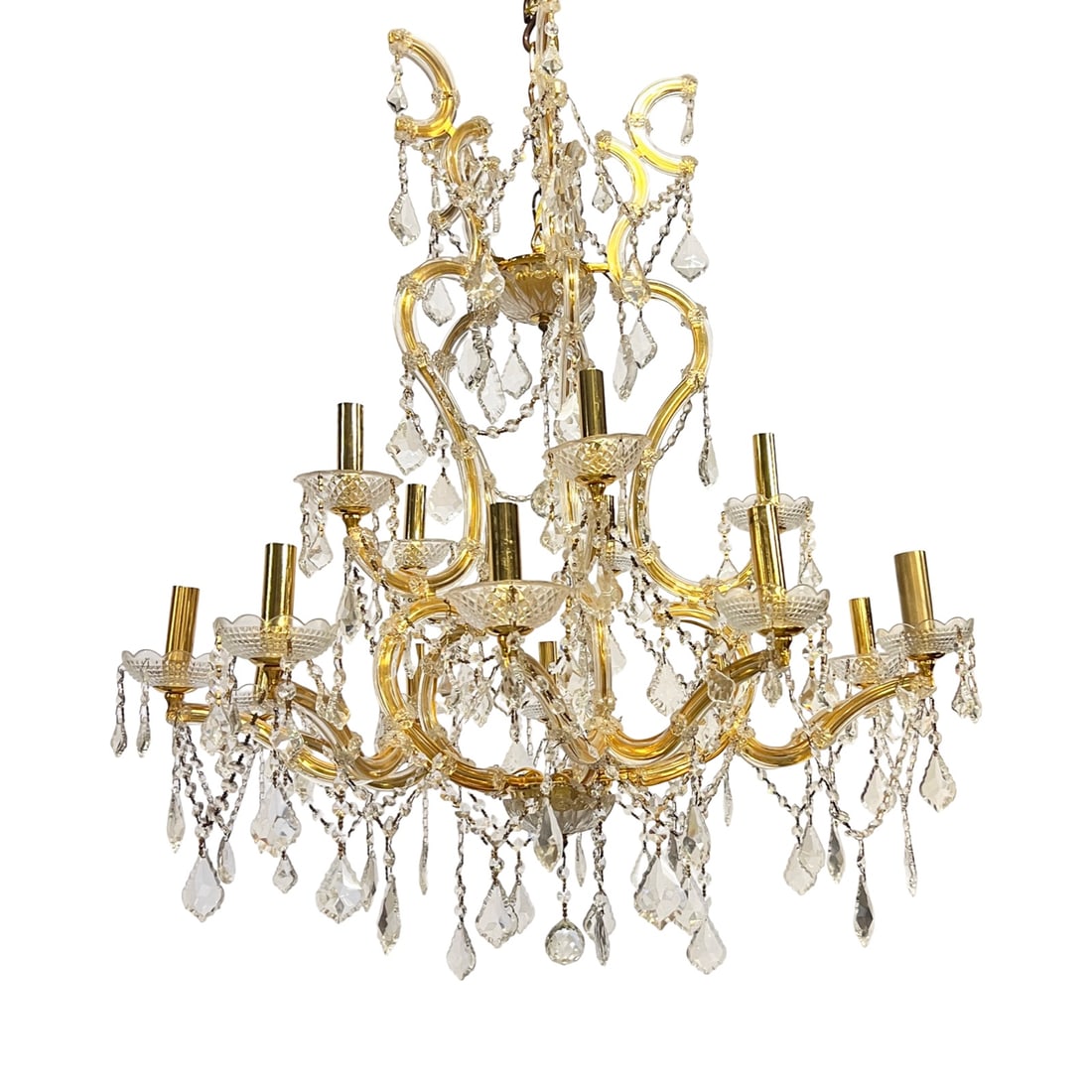 MARIA THERESA STYLE CHANDELIER: Maria Theresa style fifteen-light chandelier with Murano glass clad arms with applied rosette decoration, the whole hung with faceted colorless swags and prism, 20th century; 40"H 33"W