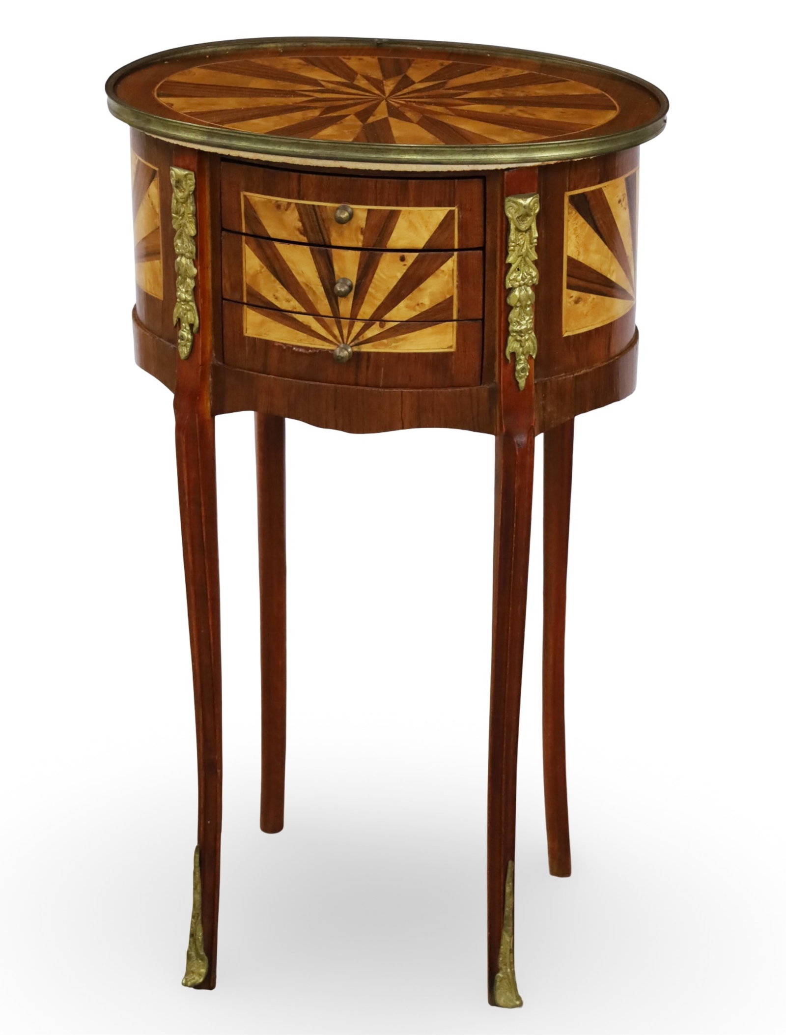 FRENCH SUNBURST INLAID MAHOGANY OCCASIONAL TABLE: French mahogany gilt bronze mounted occasional table, the top with burl starburst inlay, the case with sunburst inlaid panels, housing three drawers, raised on slender cabriole legs; 28"H 17"W 12.5"D