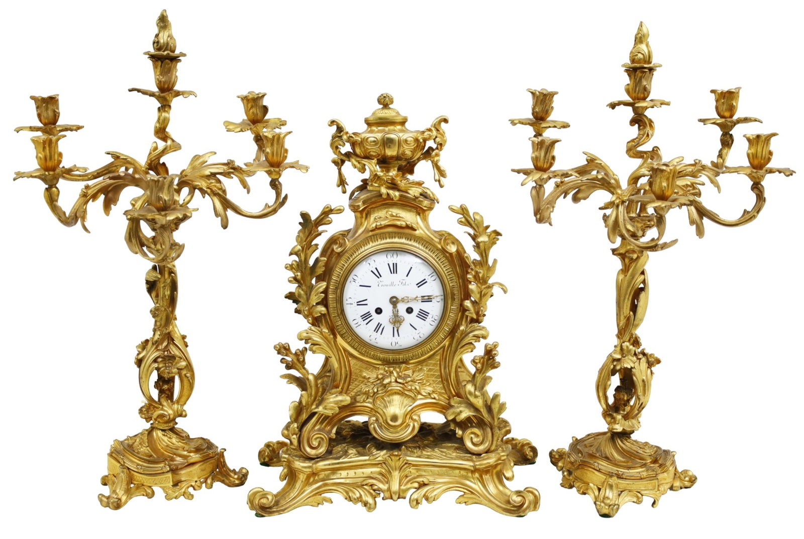 3PC FRENCH GILT BRONZE CLOCK SET, 19TH C.: Three piece French gilt bronze clock set, the clock mounted with a foliated urn, white enamel dialed inscribed Crouille Filo, Ameins, ornately cast foliate body resting on rocaille plinth, along with