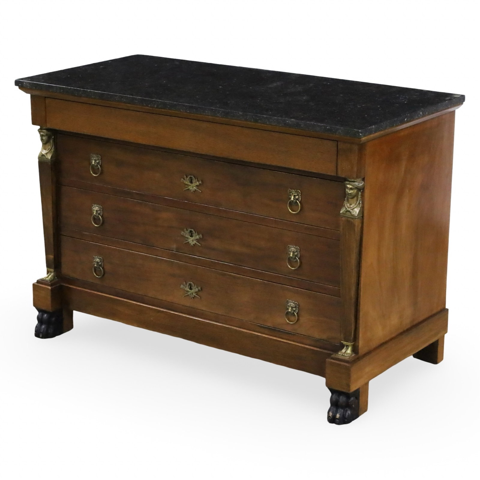 FRENCH EMPIRE MAHOGANY COMMODE: French Empire commode or chest of drawers having black marble top, the mahogany case with bronze mounted caryatid column supports, resting on paw feet, 19th century; 31"H 46"W 22"D