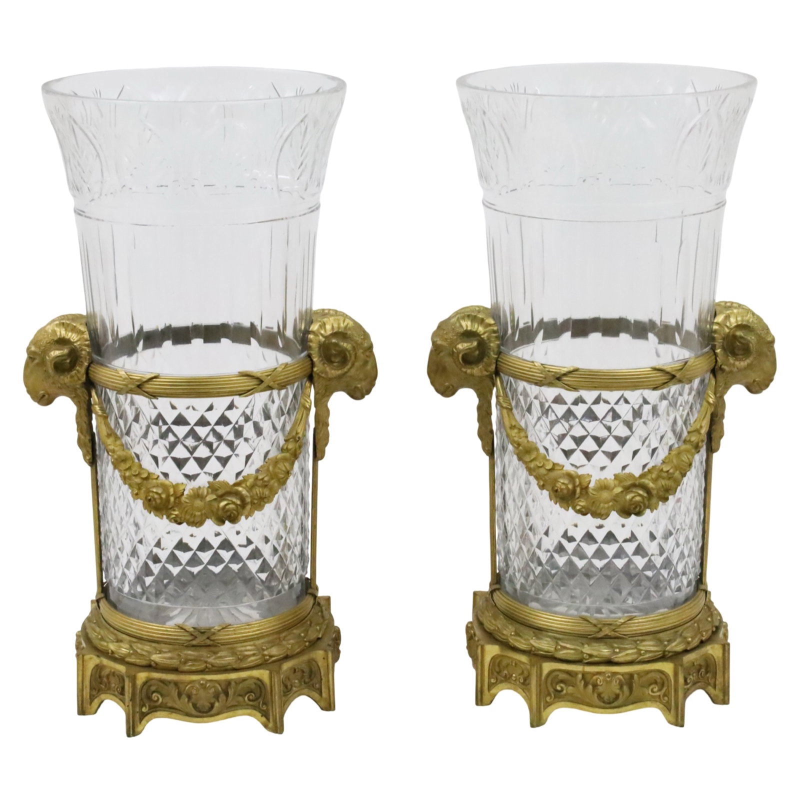 PR FRENCH REGENCY DORE BRONZE VASES DE TABLE: Fine pair of French Regency dore bronze mounted Vases de Table banquet centerpiece vases, having finely cut crystal liners, possibly Bacarrat, unsigned, and doubles rams head mounts with cross body