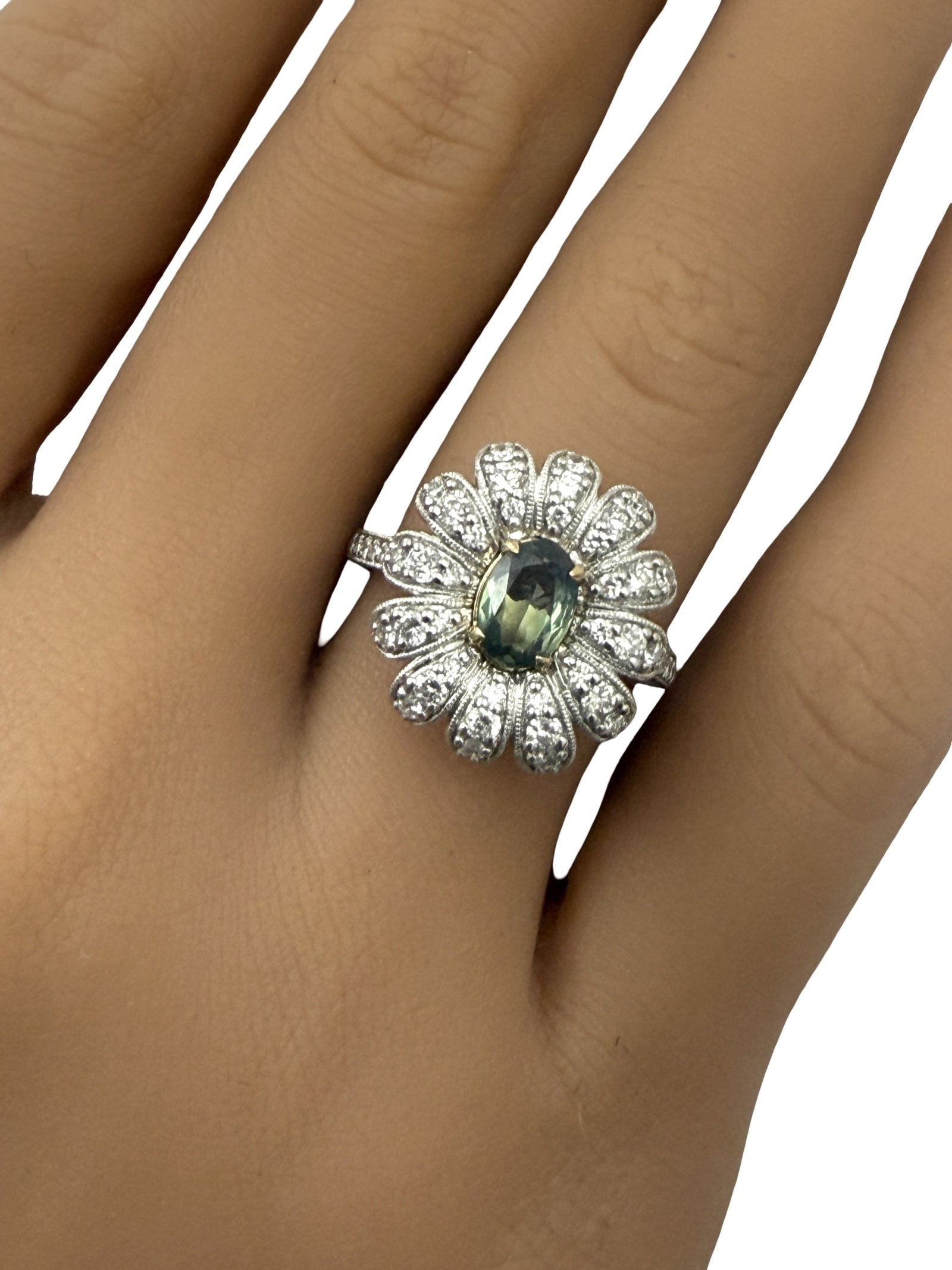 18K ALEXANDRITE AND DIAMOND RING: Platinum and 18k ring with GIA certified .69ct alexandrite surrounded by .69cts of diamonds in a floral pattern. size 7. gross weight 6.9grams. Please see all photos, appraisal, and GIA#5231228930.