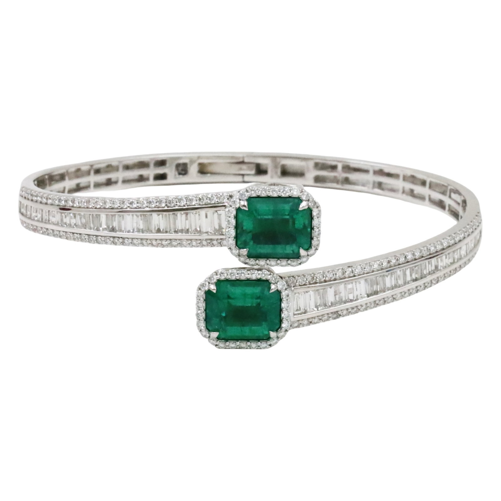 PLAT EMERALD AND DIAMOND BANGLE BRACELET: Platinum hinged bangle bracelet having 2 octagonal step cut emeralds weighing 7cts and 212 diamonds weighing 4.09cts of diamonds. total weight 29.5grams. Please see all photos and appraisal for $79455