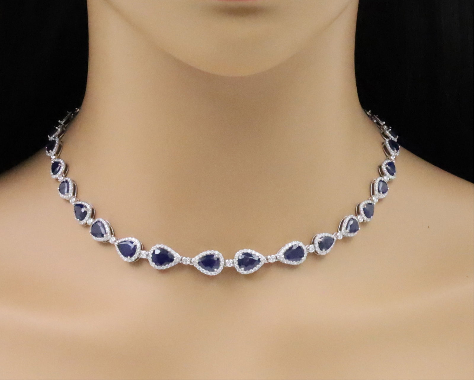 PLATINUM SAPPHIRE AND DIAMOND NECKLACE: Platinum sapphire and diamond necklace having 25.25cts of pear shaped sapphires and 5.08cts of round brilliant cut diamonds. gross weight 35.4 grams. approx 17inches long.