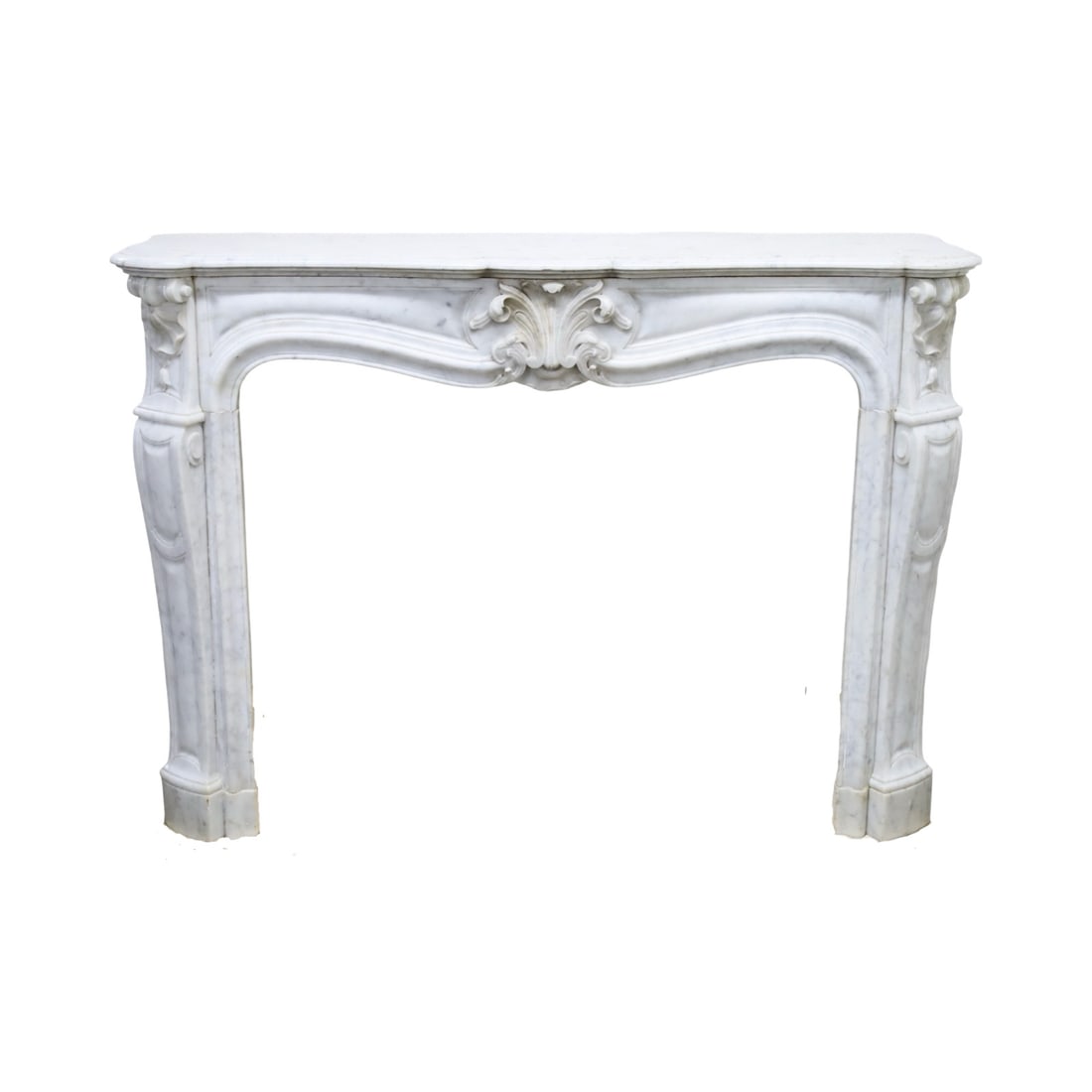 FRENCH MARBLE FIREPLACE MANTEL: French Carrara marble fireplace mantel, in the Louis XV taste, having carved shell and acanthus motif decoration; 42"H 56"W 16"D; Condition: some minor losses to center carving, repair separation