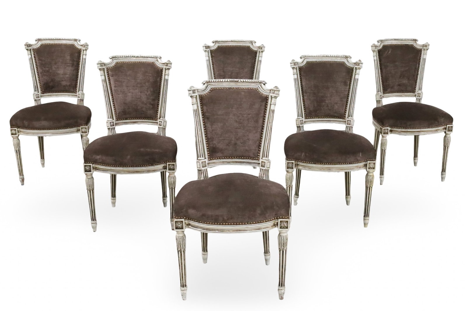 SET OF 6 LOUIS XVI STYLE DINING CHAIRS: Set of six Louis XVI style dining chairs, distressed white finish frames with carved rosette accents, covered in taupe velvet upholstery with brass nailhead trim, raised on fluted legs; each 35"H