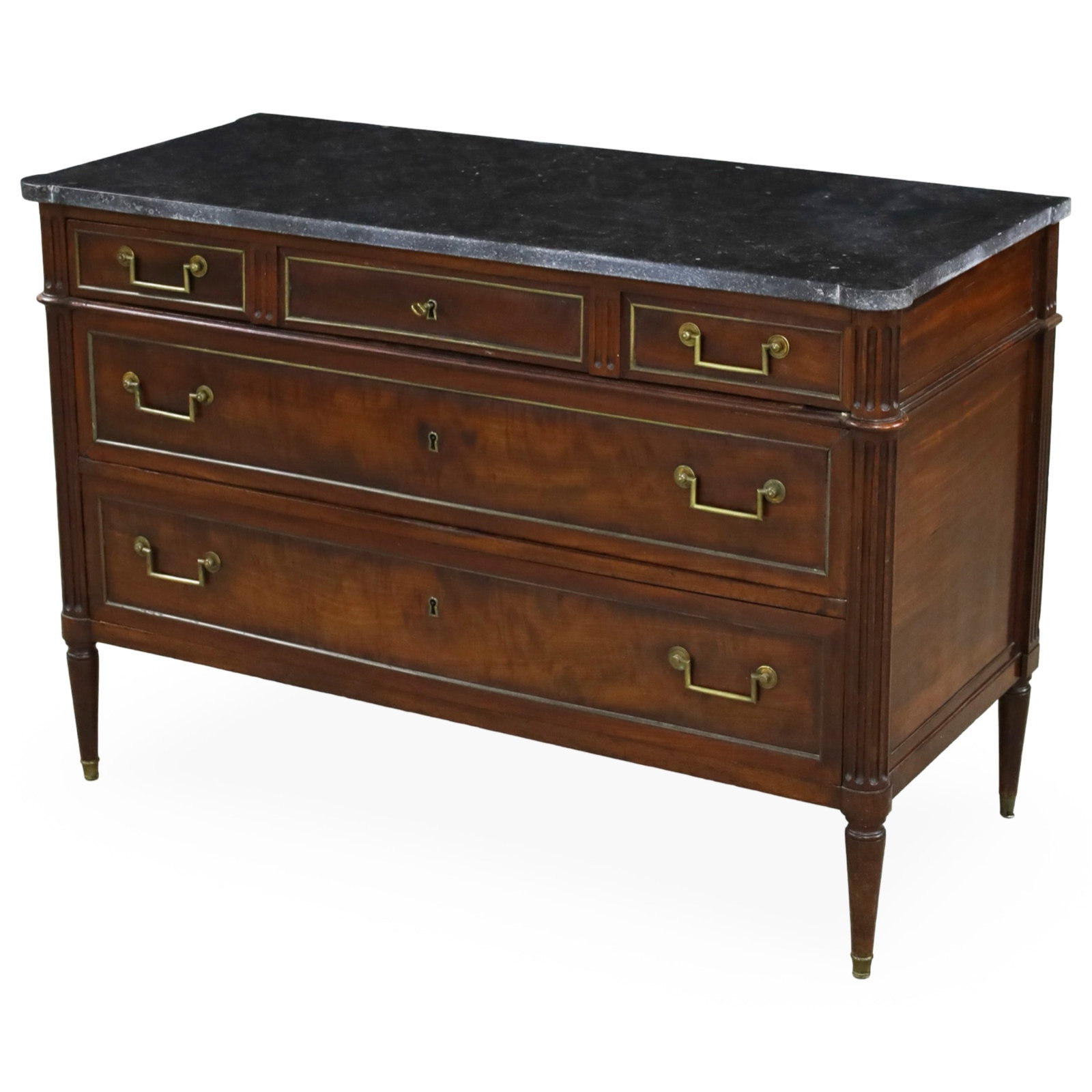 FRENCH DIRECTOIRE STYLE COMMODE: French Directoire style mahogany commode having a black marble top, fluted columns supporting three upper and two larger lower drawers, raised on tapered legs; 34"H 50"W 42.5"D