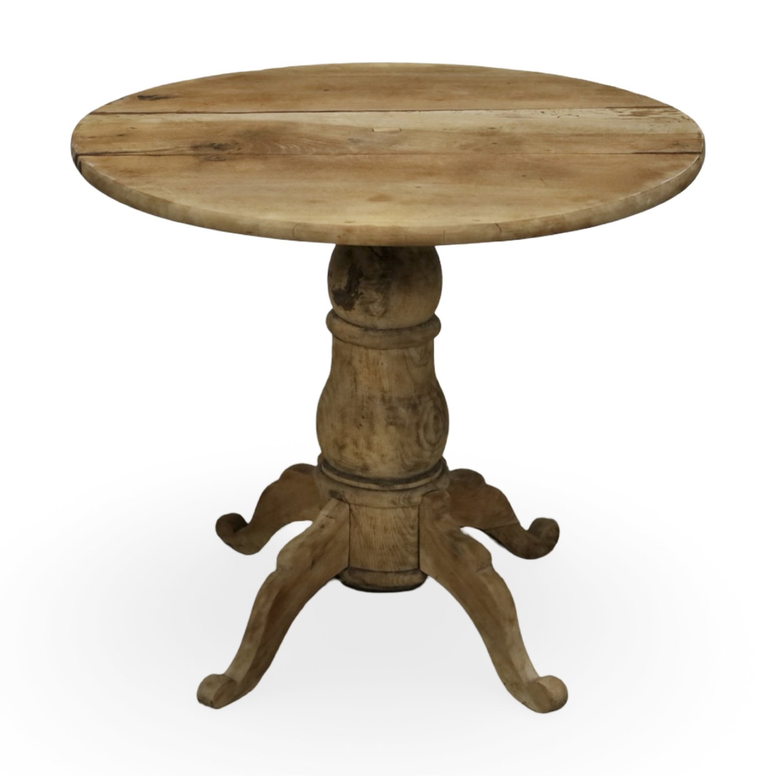 FRENCH PROVINCIAL BLEACHED ROUND PEDESTAL TABLE: Circular top raised on a turned pedestal with four scrolling legs in a bleached walnut finish. Measures 33"W x 33"D x 29"H.