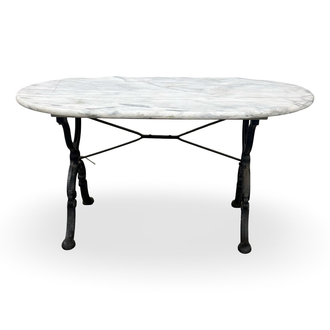FRENCH MARBLE AND IRON LOW TABLE: French cast iron low table, having an oval marble top, late 19th century; 19.5"H 39"W 24"D