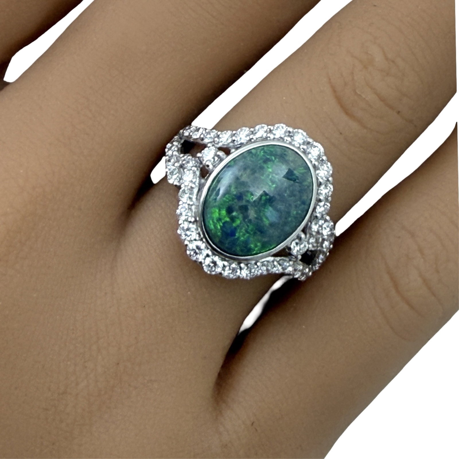 BLACK OPAL AND DIAMOND RING,GIA: Platinum ring with GIA certified opal center stone weighing 3.88ct and surrounded by .92cts of diamonds. size 6.75 . total weight 9 grams. Please see all photos, appraisal, and GIA#2231838031. Note: t