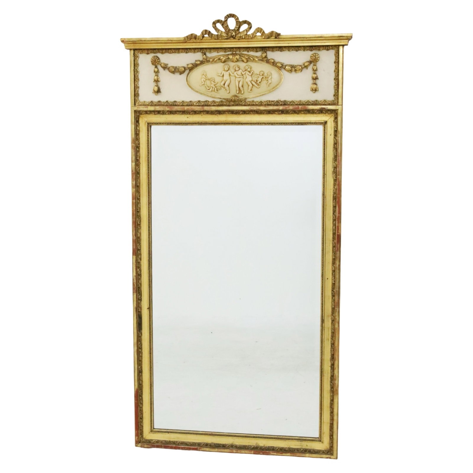 FRENCH GILTWOOD PUTTI RELIEF TRUMEAU MIRROR: French giltwood trumeau mirror, the pediment mounted with ribbon moulding crest, the panel having a festooned center reserve of putti in relief, lowering to mirror frame decorated with repeating and