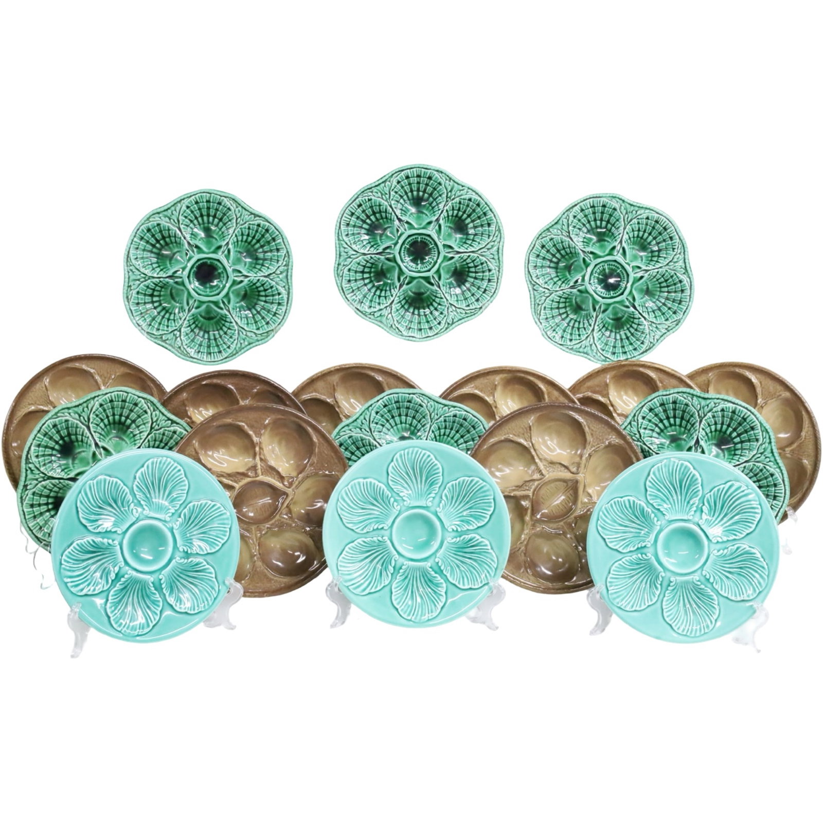 COLLECTION OF 17 FRENCH ANTIQUE OYSTER PLATES: Collection of 17 French Oyster plates in green, aqua and brown glaze. 10" diameter