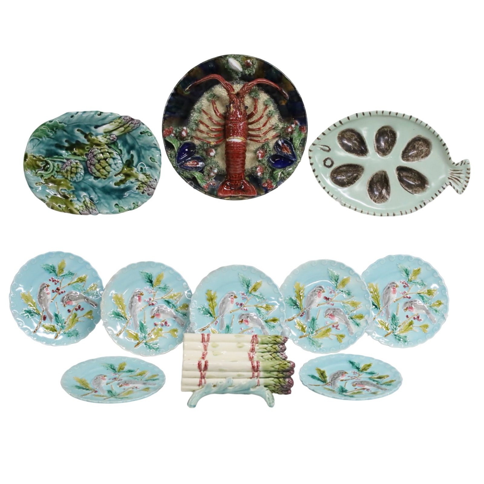 COLLECTION OF FRENCH MAJOLICA INCLUDING PALISSY: Collection of French antique majolica incuding Palissy ware lobster plate, fish oyster platter, artichoke serving platter, asparagus formed serving dish, and 7 bird decorated dessert plates. Lobster