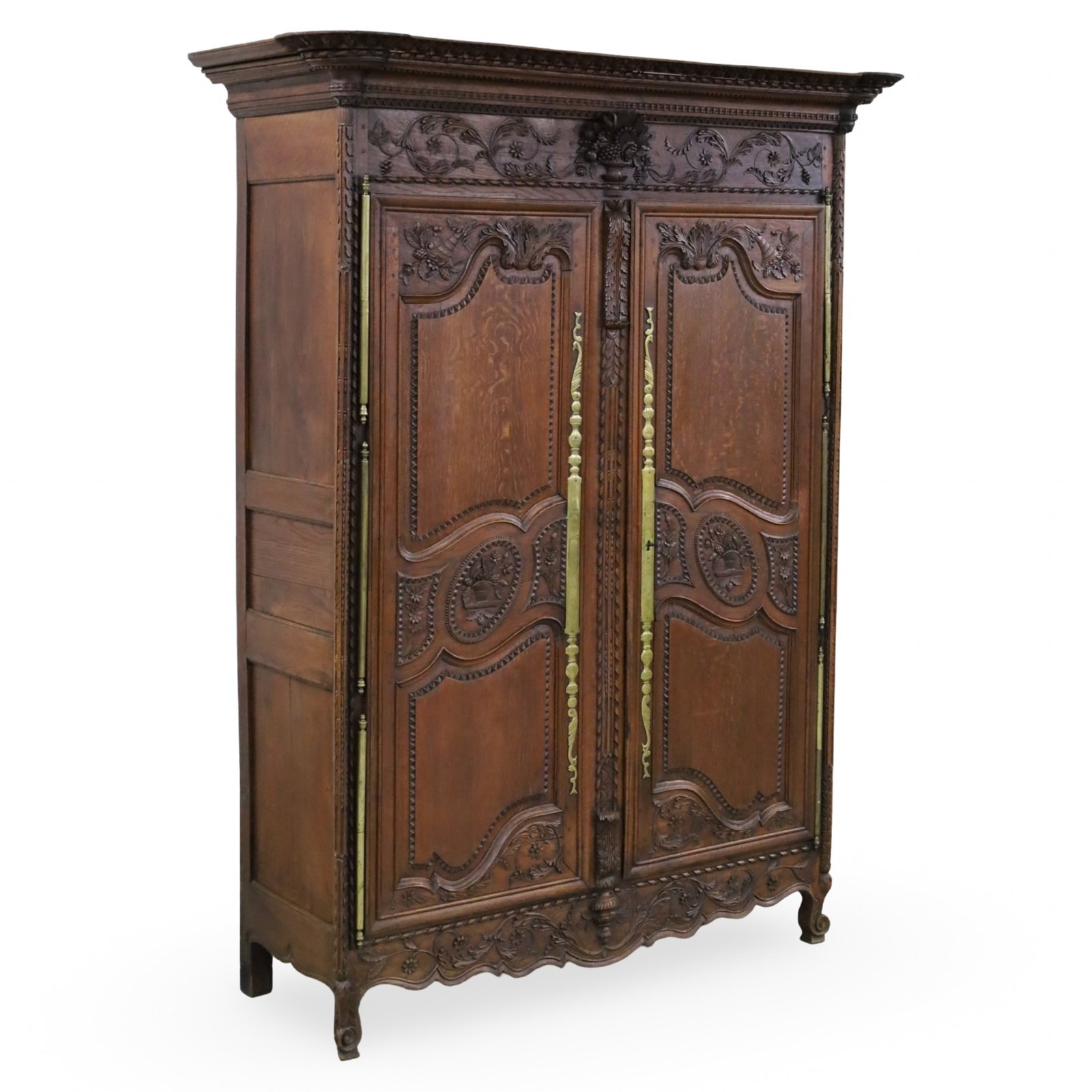 LOUIS XV STYLE OAK AMOIRE, 19TH C.: Louis XV style oak armoire, elaborately carved with shaped panel doors, 19th century; 88"H 57"W 21"D