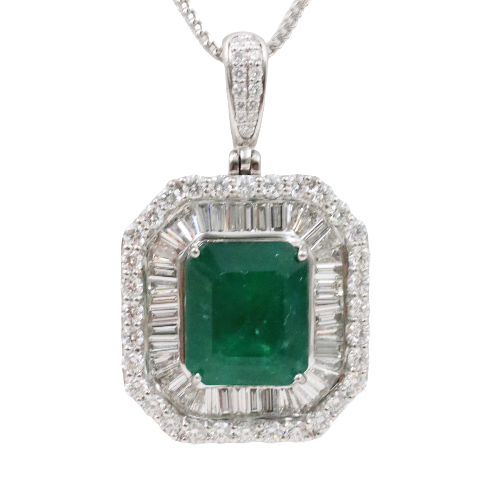 GIA PLAT EMERALD AND DIAMOND PENDANT: Platinum pendant necklace mounted with 1 GIA certified ermald center stone weighing 10.28cts and surrounded by 88 diamonds weighing 3.51 cts. Emerald measures 13.95 x 11.73 x 8.06mm. total weight 23.2
