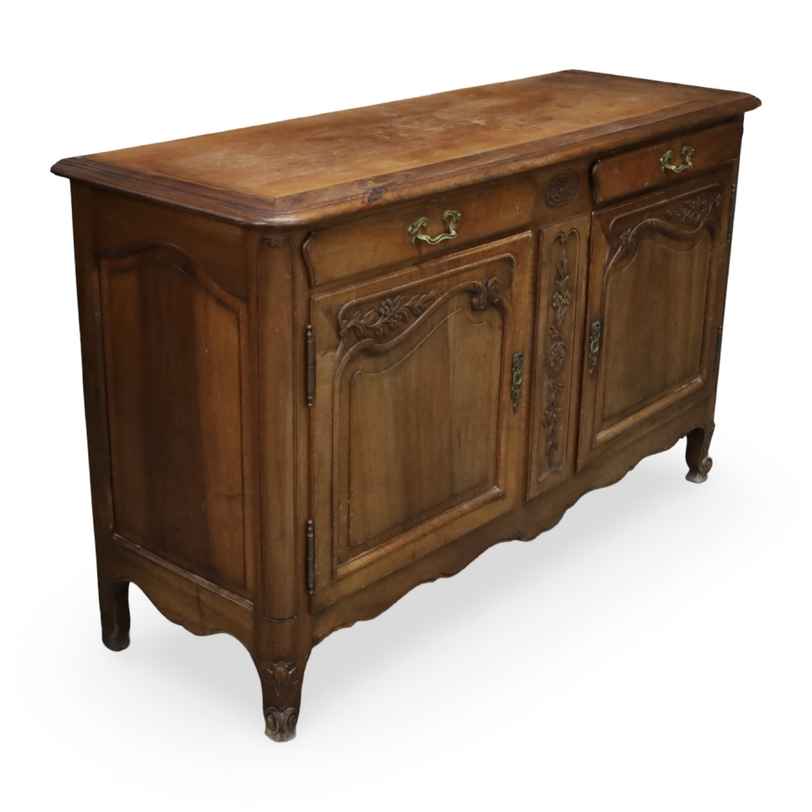 FRENCH PROVINCIAL WALNUT TWO-DOOR BUFFET: French Provincial walnut buffet with molded top above two paneled cupboard doors opening to a shelved interior, raised on shaped bracket feet. Measures 63"W x 22"D x 39"H.