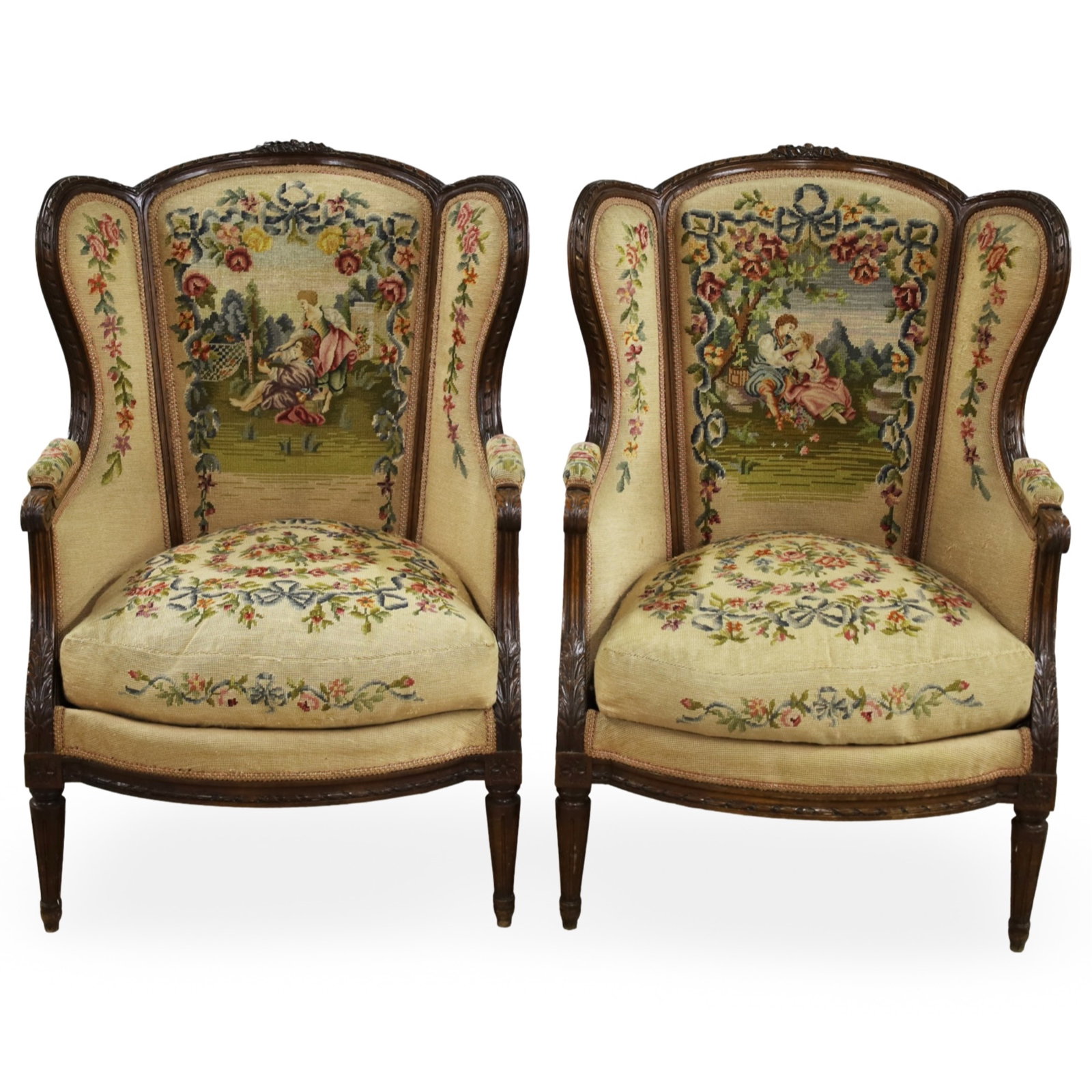 PR FRENCH LOUIS XVI STYLE NEEDLEPOINT BERGERES: Pair of Louis XVI style bergeres, carved walnut frames with needlepoint upholstery with courting scene reserves; each 43"H 30"W 24"D