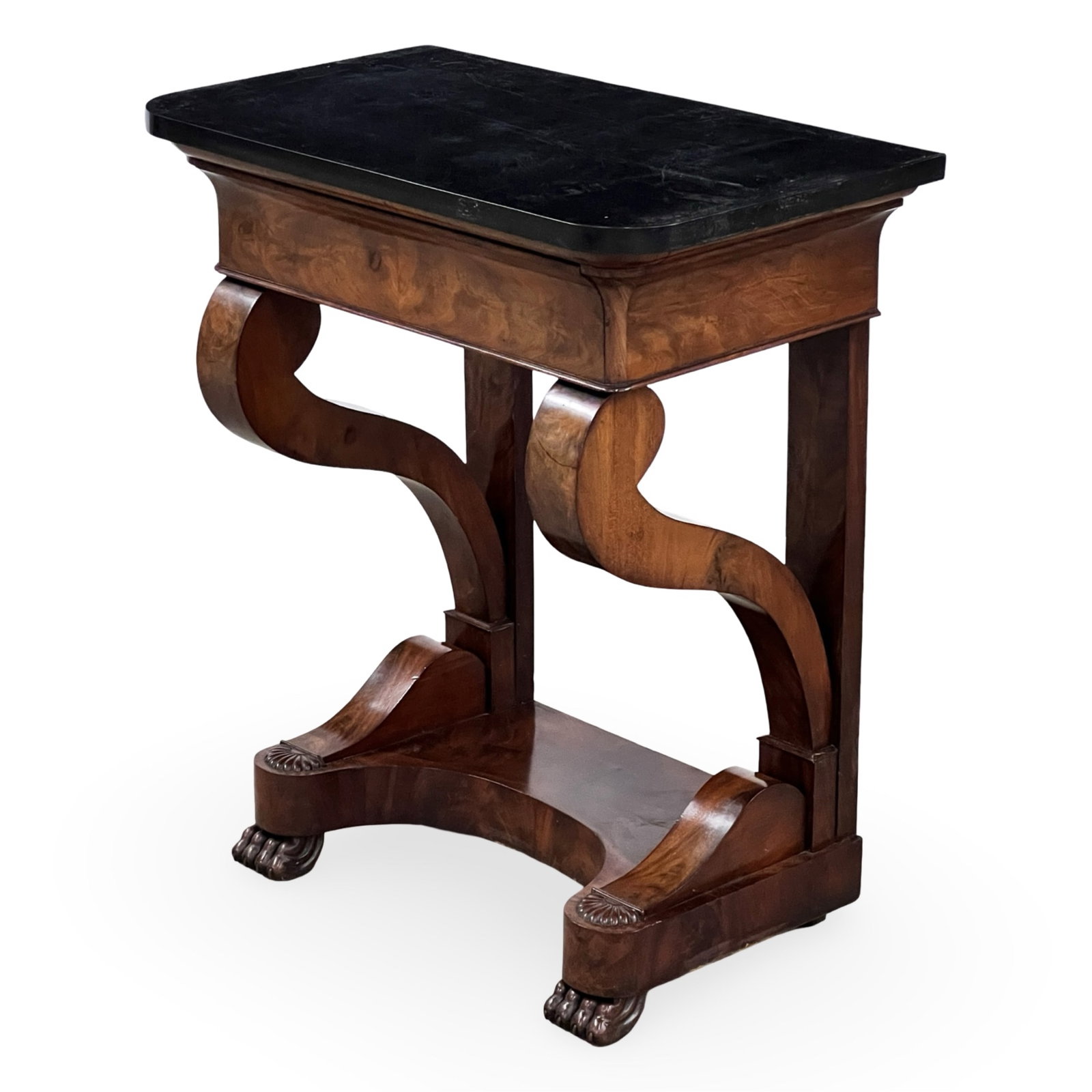 FRENCH EMPIRE MARBLE TOP CONSOLE: Petite French Empire mahogany console having a black marble top, scroll arms supports, resting on paw feet; 31.5"H 28"W 16"D