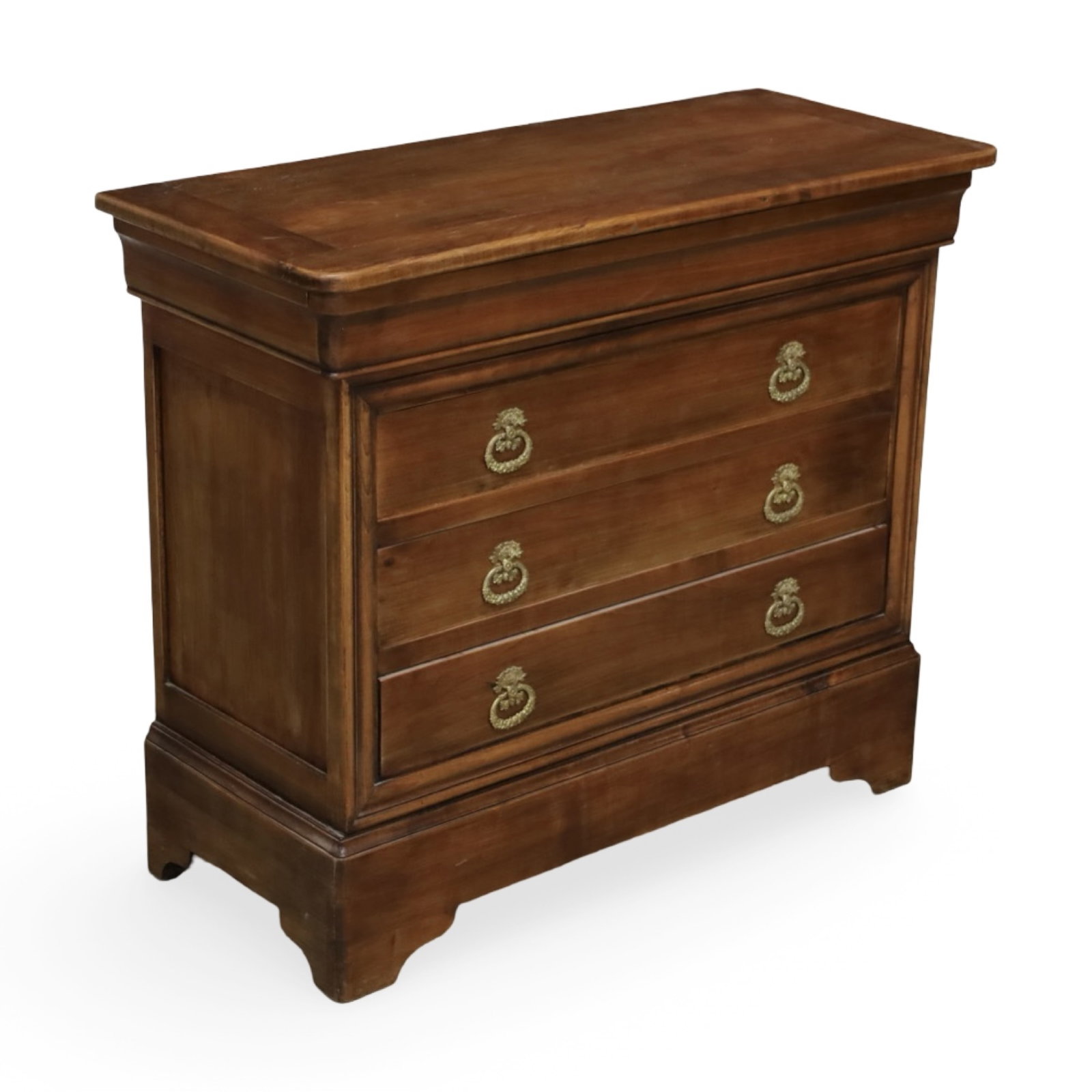 FRENCH PROVINCIAL THREE-DRAWER CHEST: French Provincial walnut chest with three dovetailed drawers fitted with brass ring pulls and a molded case.