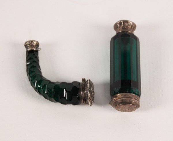 MISCELLANEOUS LOT OF 2 SCENT BOTTLES: MISCELLANEOUS LOT OF 2 SCENT BOTTLES CONSISTING OF A POWDER HORN SHAPED EMBOSSED SILVER AND GREEN CUT GLASS SCENT BOTTLE WITH CASE, ALONG WITH A DECAGON EMERALD CUT CRYSTAL AND SILVER ENGRAVED AND EMB