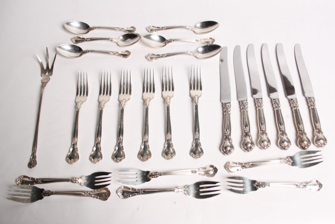 24 PIECES OF STERLING SILVER 23 TROY OZS.: 24 PIECES OF CHANTILLY PATTERN STERLING SILVER FLATWARE CONSISTING OF 6 DINNER FORKS, 6 LUNCHEON FORKS, 6 TEASPOONS, AND 6 DINNER KNIVES; ALONG WITH 1 LONG SERVING FORK, NOT MATCHING, 25 TOTAL PCS.; A