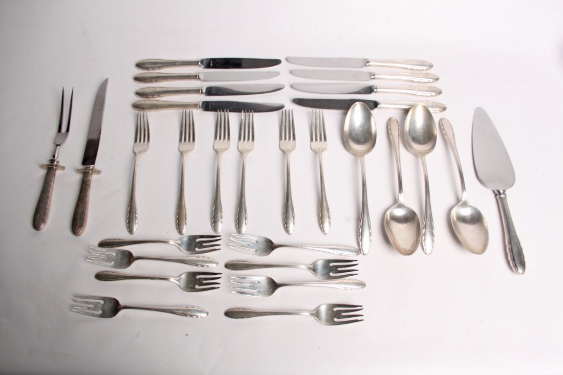 27 PIECES OF STERLING SILVER FLATWARE: 27 PIECES OF LYRIC PATTERN STERLING SILVER FLATWARE BY GORHAM CONSISTING OF 6 DINNER FORKS, 8 LUNCHEON FORKS, 4 STUFFING SPOONS, 8 DINNER KNIVES, 1 CAKE SERVER, ALONG WITH 2 PIECE CARVING SET, NOT MAT