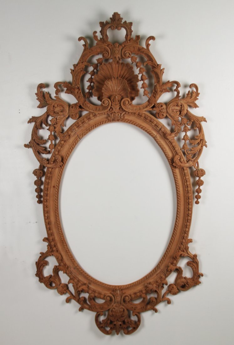IMPRESSIVE CARVED WOOD MIRROR FRAME: IMPRESSIVE CARVED WOOD MIRROR FRAME WITH CONCAVE SHELL CENTER MEDALLION; 70"H X 37"W