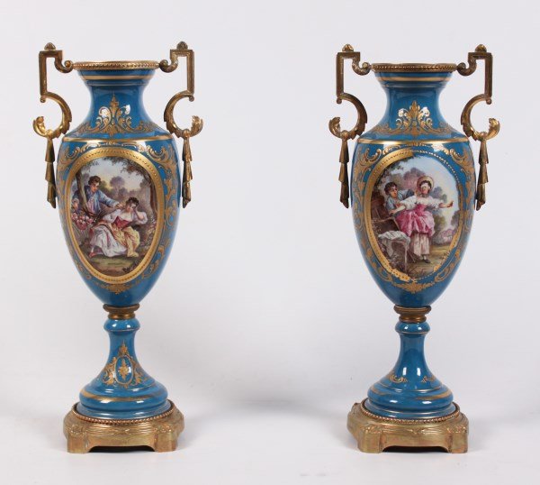 PAIR OF ROBIN EGG BLUE GROUND SEVRES STYLE VASES SIGNED: PAIR OF ROBIN EGG BLUE GROUND SEVRES STYLE VASES WITH COURTING SCENE VIGNETTES SIGNED H. GOITEVIN; 14"H; MISSING LIDS, LOSSES TO THE RAISED GOLD DECORATION