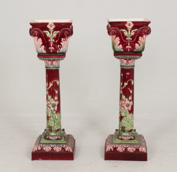 PAIR OF BURGUNDY GROUND AND FLORAL GLAZED CERAMIC: PAIR OF BURGUNDY GROUND AND FLORAL RAISED RELIEF DESIGN GLAZED CERAMIC PLANTERS ON STANDS, PROBABLY FRENCH 19TH/20TH C.; 46.5"H X 13.5"SQUARE; CONDITION: BOTH HAVE CRAZING TO INTERIOR OF PLANTER