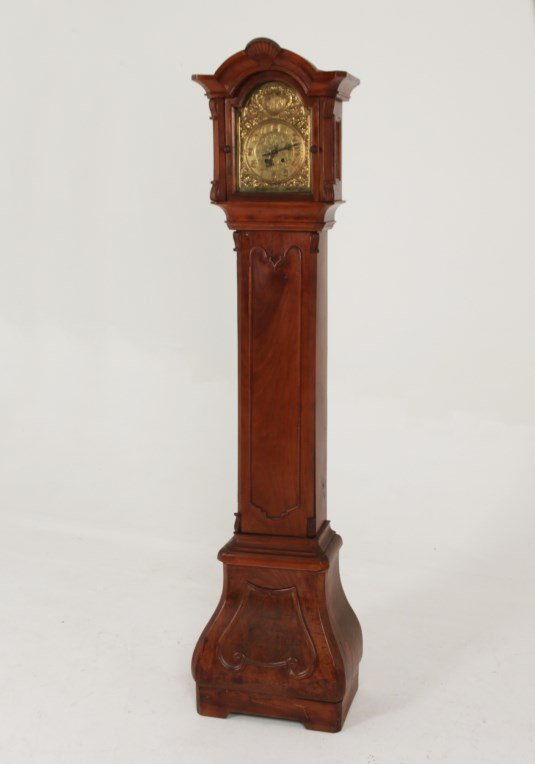 DUTCH WALNUT BOMBE SHAPED GRANDMOTHER CLOCK: DUTCH WALNUT BOMBE SHAPED GRANDMOTHER CLOCK WITH BRASS EMBOSSED DIAL, LATE 19TH C.; 73"H X 14"W X 10"D; CONDITION: WE DO NOT GUARANTEE ANY CLOCK TO BE IN RUNNING CONDITION, NOR THEIR WORKING PARTS