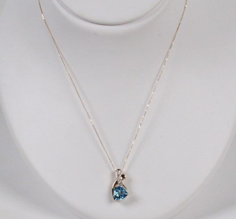 14K DIAMOND AND SWISS BLUE TOPAZ PENDANT NECKLACE: 14K YELLOW GOLD DIAMOND AND SWISS BLUE TOPAZ PENDANT NECKLACE HAVING 8MM TRIANGULAR BLUE TOPAZ