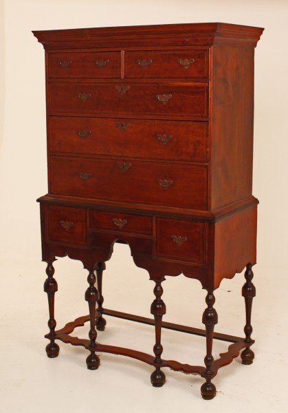 FINE 18TH C. AMERICAN CHERRY WOOD INLAID HIGHBOY: FINE AMERICAN CHERRY WILLIAM AND MARY INLAID HIGHBOY WITH TRUMPET SHAPED LEGS AND SHAPED STRETCHER, 18TH C.; 67"H X 39.5"W X 20.25"D