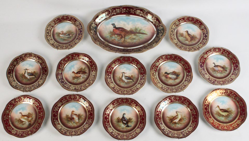 13 PIECE CRIMSON GROUND PORCELAIN HANDPAINTED FOWL SET: ROYAL VIENNA STYLE 13 PIECE CRIMSON GROUND PORCELAIN FOWL SET MARKED ON THE REVERSE ROYAL VIENNA WITH GOLD BEEHIVE AND CROWN UNDERGLAZE READING "MIGNON Z.S. & C? BAVARIA" CONSISTING OF 12-9" PLATES AN