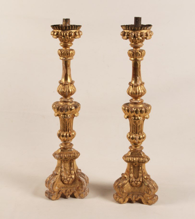 PAIR OF 19TH C. ITALIAN CARVED GILTWOOD PRICKET: PAIR OF 19TH C. ITALIAN CARVED GILTWOOD PRICKET CANDLESTICKS; 28.5" H; CONDITION: LOSSES TO GESSO AND GILDING THROUGHOUT, AREAS OF WORMING