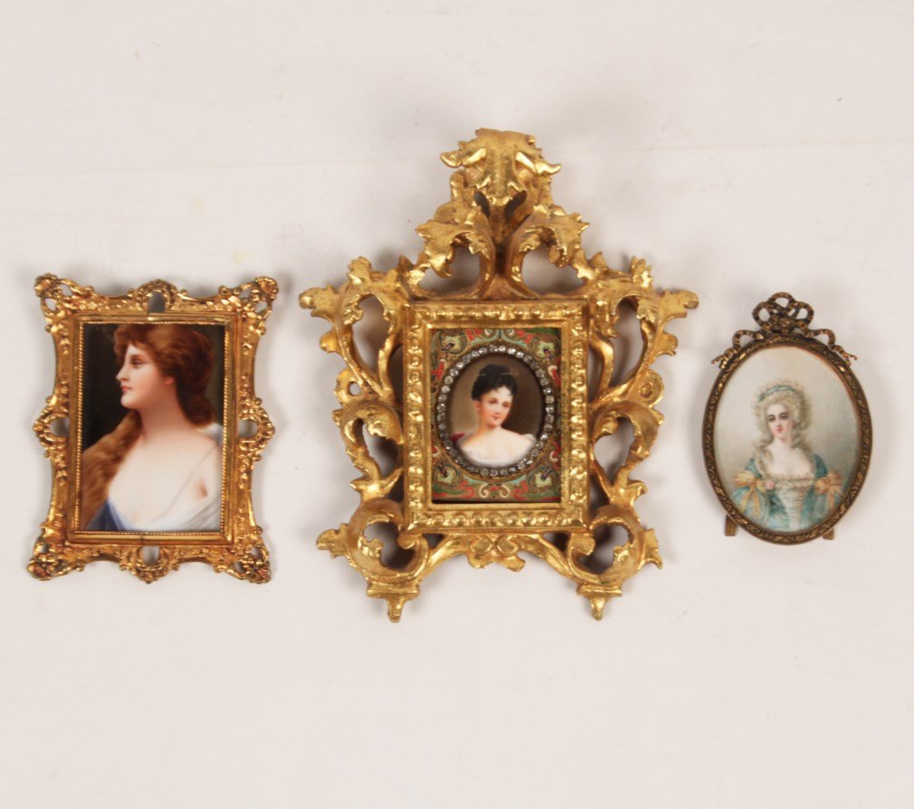 GROUP OF 3 HAND PAINTED MINIATURES: GROUP OF 3 HAND PAINTED MINIATURES, 1 ON IV0RY, 2 ON PORCELAIN 1 OF WHICH IS IN AN ENAMELED AND FLORENTINE CARVED FRAME; 9.25"H X 7.5"W OVERALL, THE ONE IN FLORENTINE FRAME