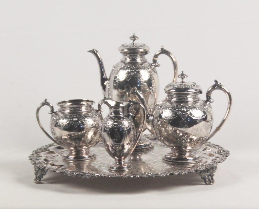 4 PIECE HALLMARKED STERLING SILVER TEA AND COFFEE: 4 PIECE HALLMARKED STERLING SILVER TEA AND COFFEE SERVICE HAVING COFFEE POT, TEA POT, CREAM AND SUGAR, ALONG WITH FOOTED SILVER PLATED CIRCULAR TRAY, MONOGRAMMED "S"; 11.5"H COFFEE POT, 8.5"H TEAPOT, 