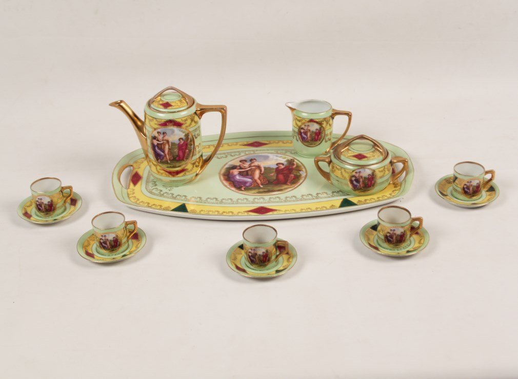14 PIECE VIENNA STYLE PORCELAIN TEA SERVICE: 14 PIECE VIENNA STYLE PORCELAIN TEA SERVICE INCLUDING A COVERED TEAPOT, CREAMER, COVERED SUGAR, AND FIVE CUPS AND SAUCERS, MARKED ON THE REVERSE WITH BLUE BEEHIVE, CZECHO SLOWAKIA; 6"H TEAPOT, 19" X 1