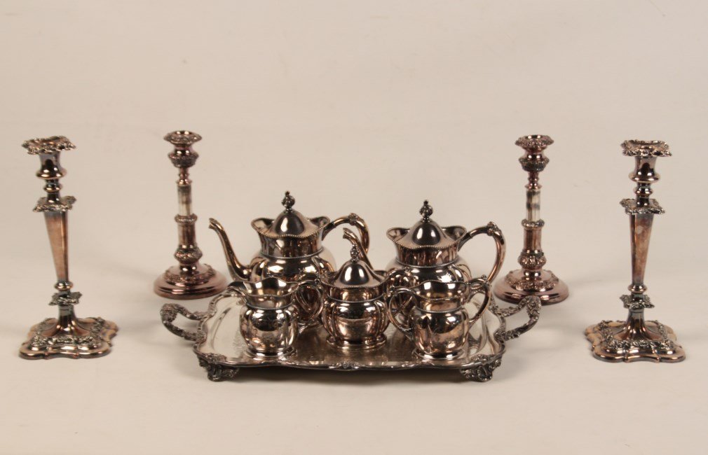 10 PIECE LOT OF SILVER PLATE: 10 PIECE LOT OF SILVER PLATE CONSISTING OF A 6 PIECE PLATED TEA SERVICE WITH FOOTED TRAY, 2 PAIRS OF ENGLISH CANDELSTICKS 12"H (SMALLER PAIR RETRACTABLE)