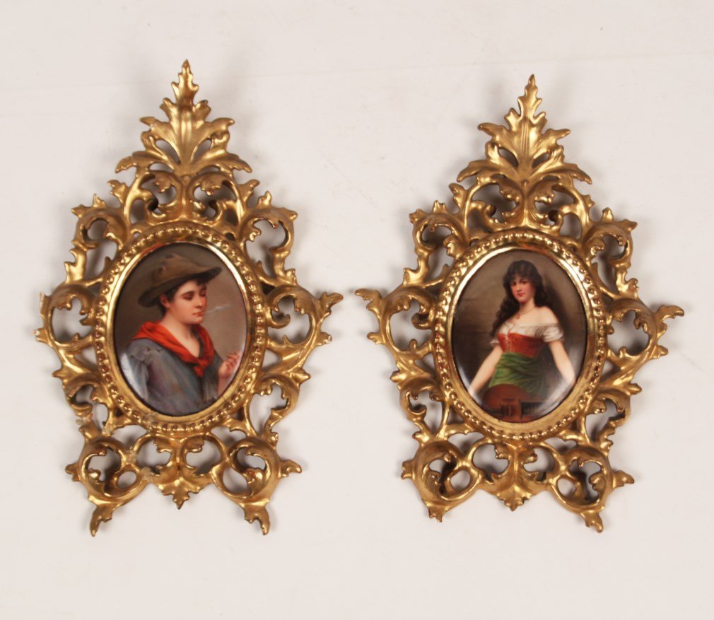 PAIR OF ITALIAN CHARACTER STUDIES PAINTED ON PORCELAIN: PAIR OF ITALIAN CHARACTER STUDIES PAINTED ON PORCELAIN IN FLORENTINE CARVED GILT FRAMES; 12.5"H X 8.5"W OVERALL; CONDITION: FRAME OF STUDY OF YOUNG MAN HAS BEEN BROKEN AND RE-GLUED AND MISSING SOME PI