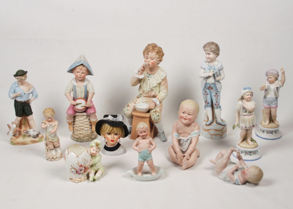 GROUP OF 12 BISQUE PORCELAIN FIGURES: GROUP OF 12 BISQUE PORCELAIN FIGURES INCLUDING 3 BABIES, A BOY WITH DRUMS, A BOY WITH PIPE, A PAIR OF FIGURES, A BOY WITH CHICKENS, A BOY IN BLUE, AND A BUST OF A WOMAN, FIGURE OF GIRL WITH DOLL, CHIL