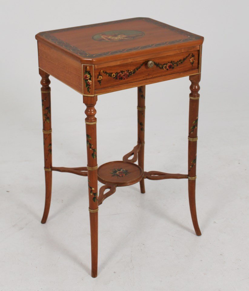 ENGLISH SATINWOOD ADAMS DECORATED ONE DRAWER STAND: ENGLISH SATINWOOD ADAMS DECORATED ONE DRAWER STAND ON BAMBOO STYLIZED TURNED SPLAY LEGS HAVING CENTER OVAL PAINTED WITH PARTIALLY CLAD WOMAN WITH LUTE AND PIERCED UNDERSTRETCHER; 27.5"H X 17"W X 14.25